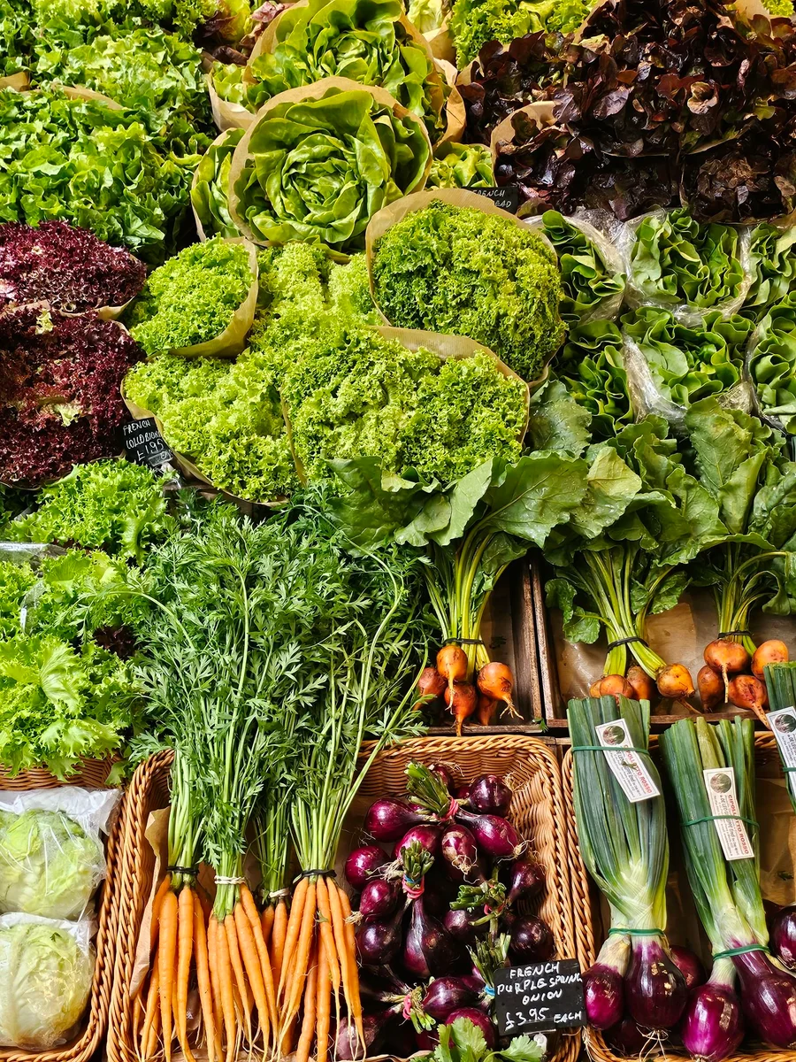 Loose greens, lettuces, carrots and seasonal vegetables on display at Bora & Sons