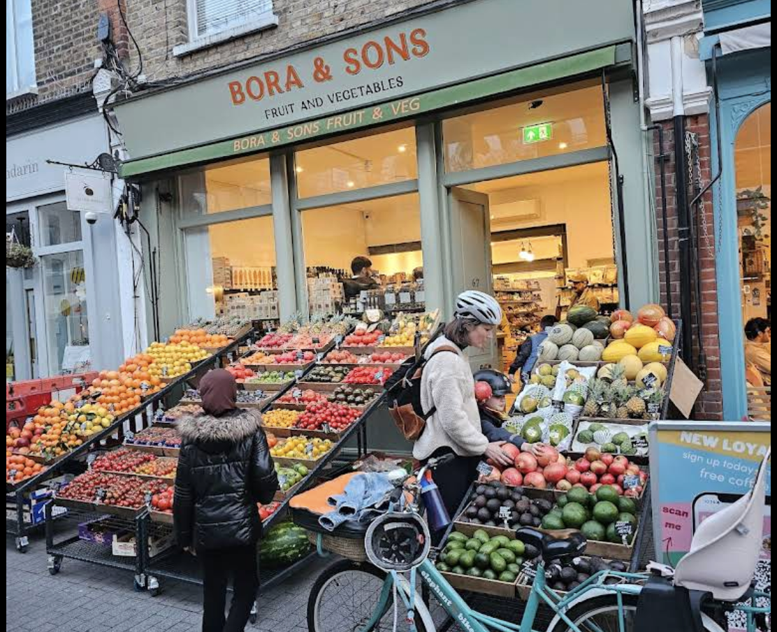 The Bora & Sons shopfront on Orford Road, Walthamstow — produce displays spilling onto the pavement under a green awning